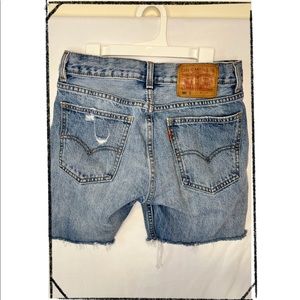 Levi’s women’s size 26” waist blue cut off distressed jean shorts.